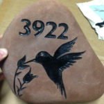 Engraved address on rock