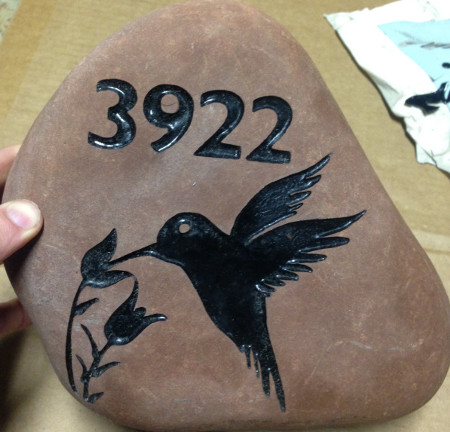Engraved address on rock